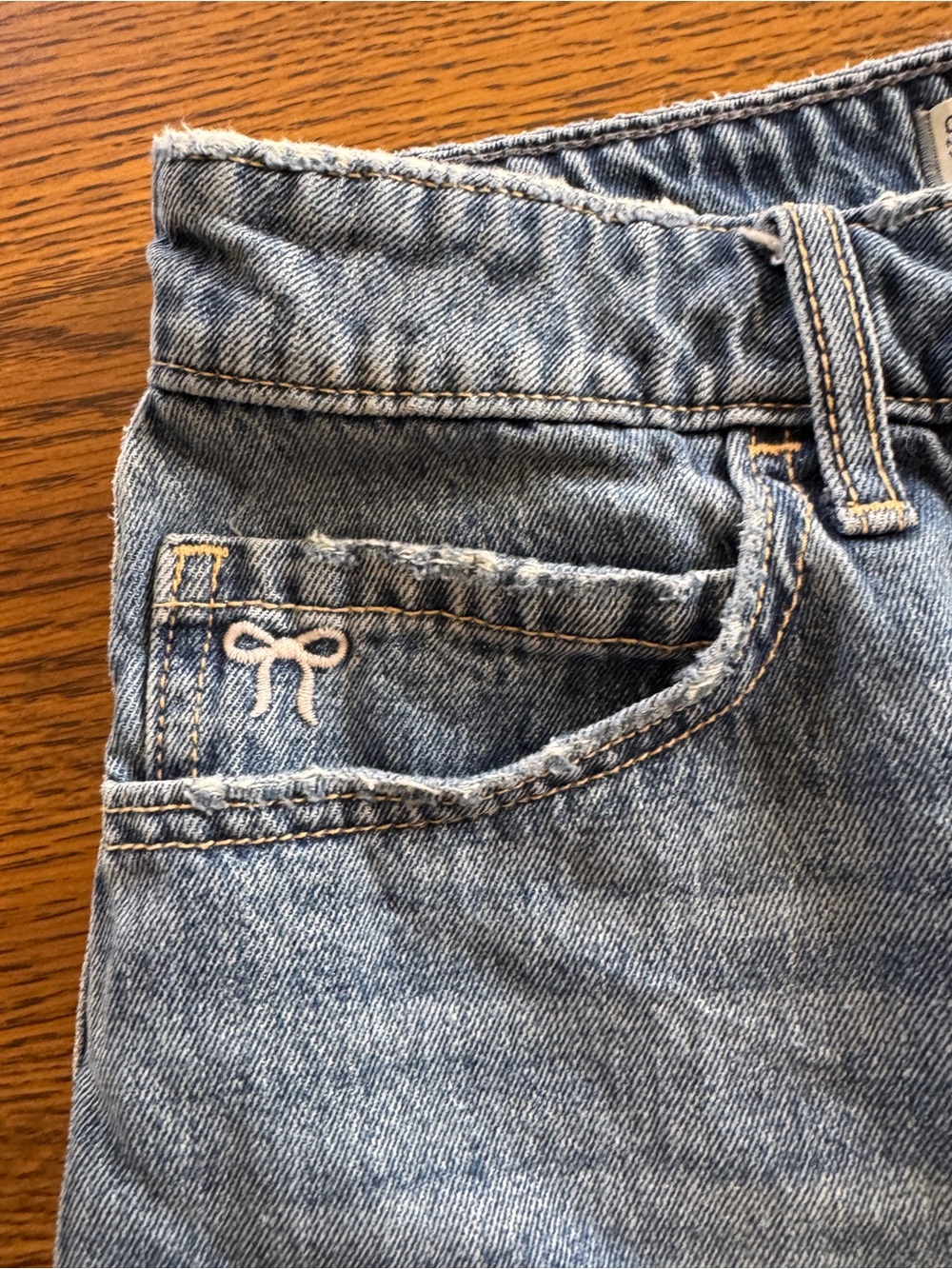 Hollister Blue Denim Mini Skirt with Pink Bow Accents and Built-In Shorts - Picture 4 of 6